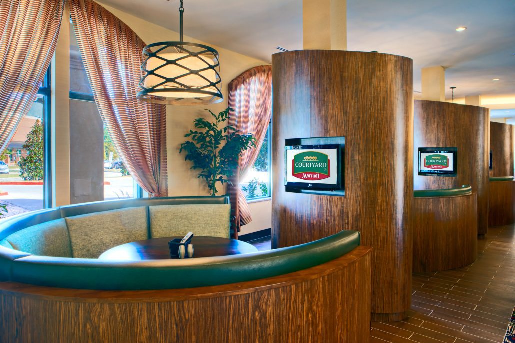 Courtyard by Marriott booth with a tv