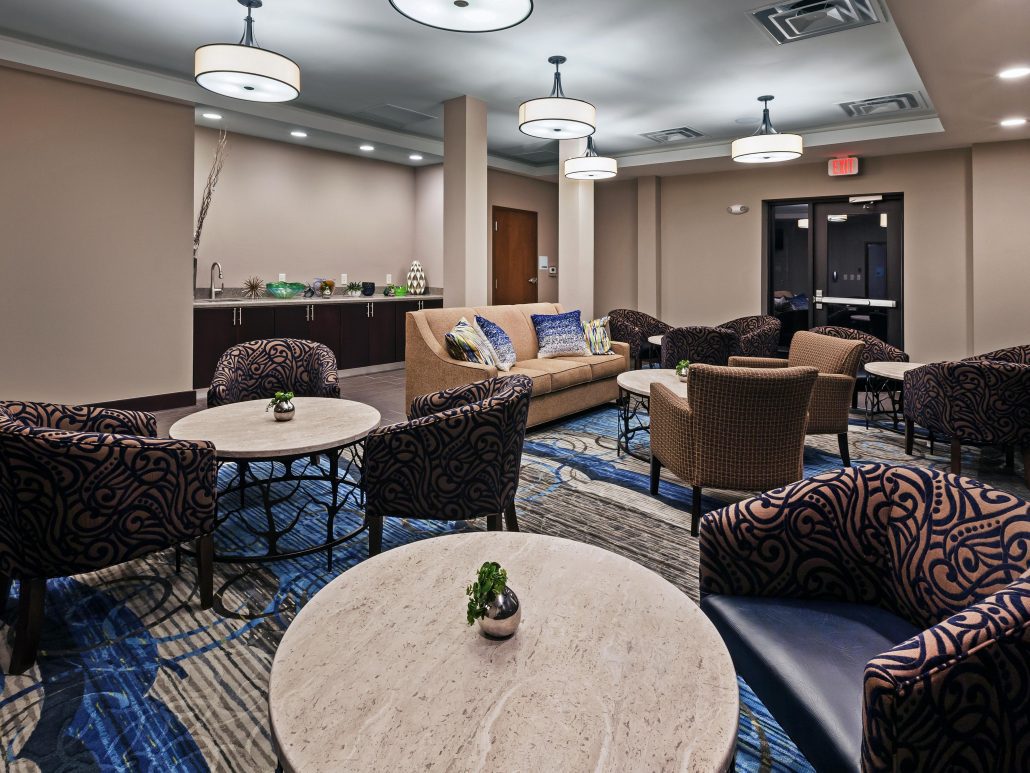 Holiday Inn Express secondary lounge area with additional seating and sofa