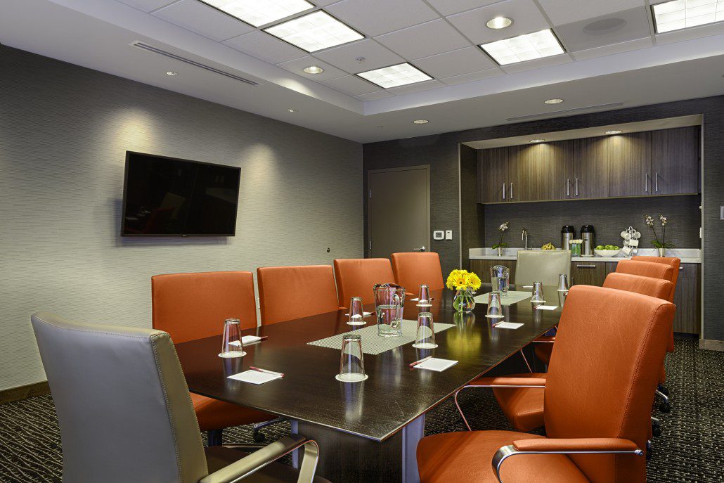 Residence Inn by Marriott conference room with orange office chair and long table