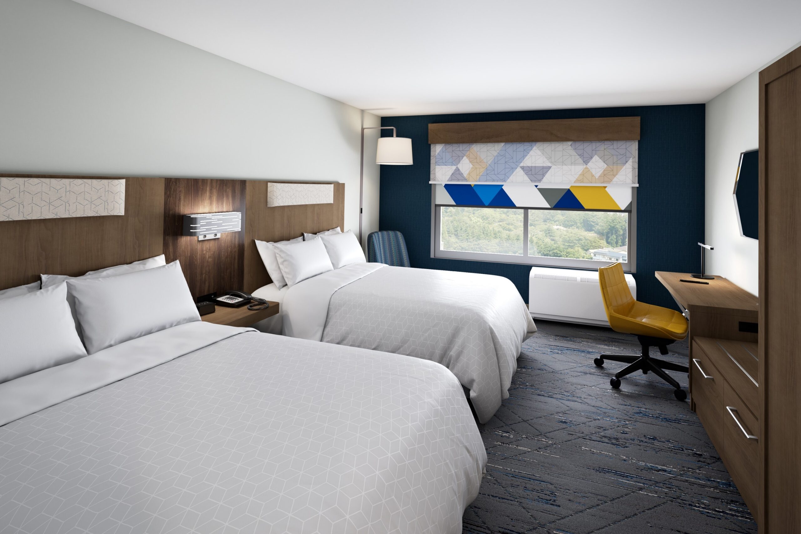 Hotel room with two queen size beds and blue, white, and yellow checkered curtain