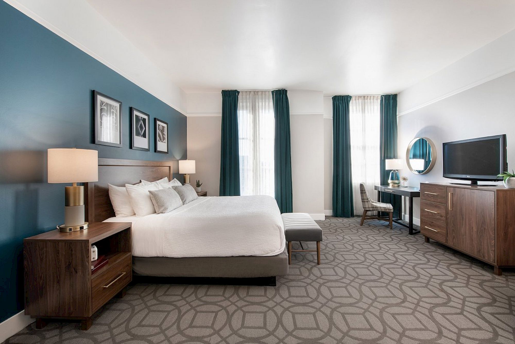 Magnolia Hotel Room with king size bed blue accent wall