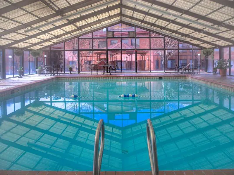 Large indoor pool with large windows