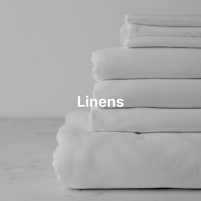 Luxury hospitality linens including flat sheets, fitted sheets, pillowcases, and bath towels Soft, high-thread-count hotel linens designed for comfort, durability, and repeated washing