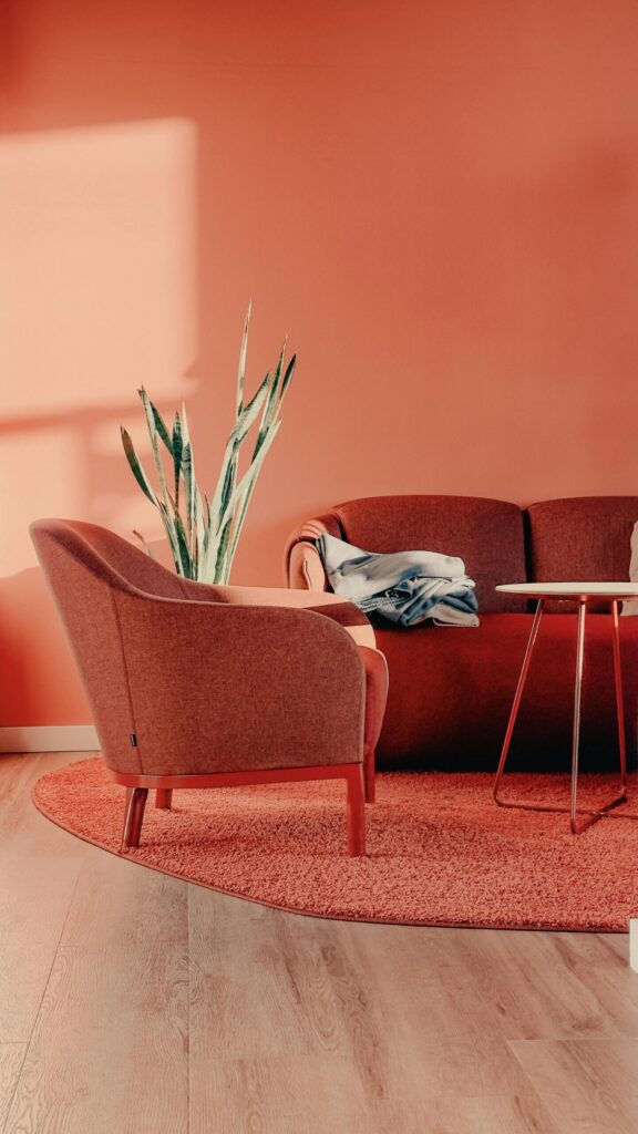 pexels-photo-20036266-20036266 A stylish minimalist living room with peach walls and modern furniture in Berlin, Germany.